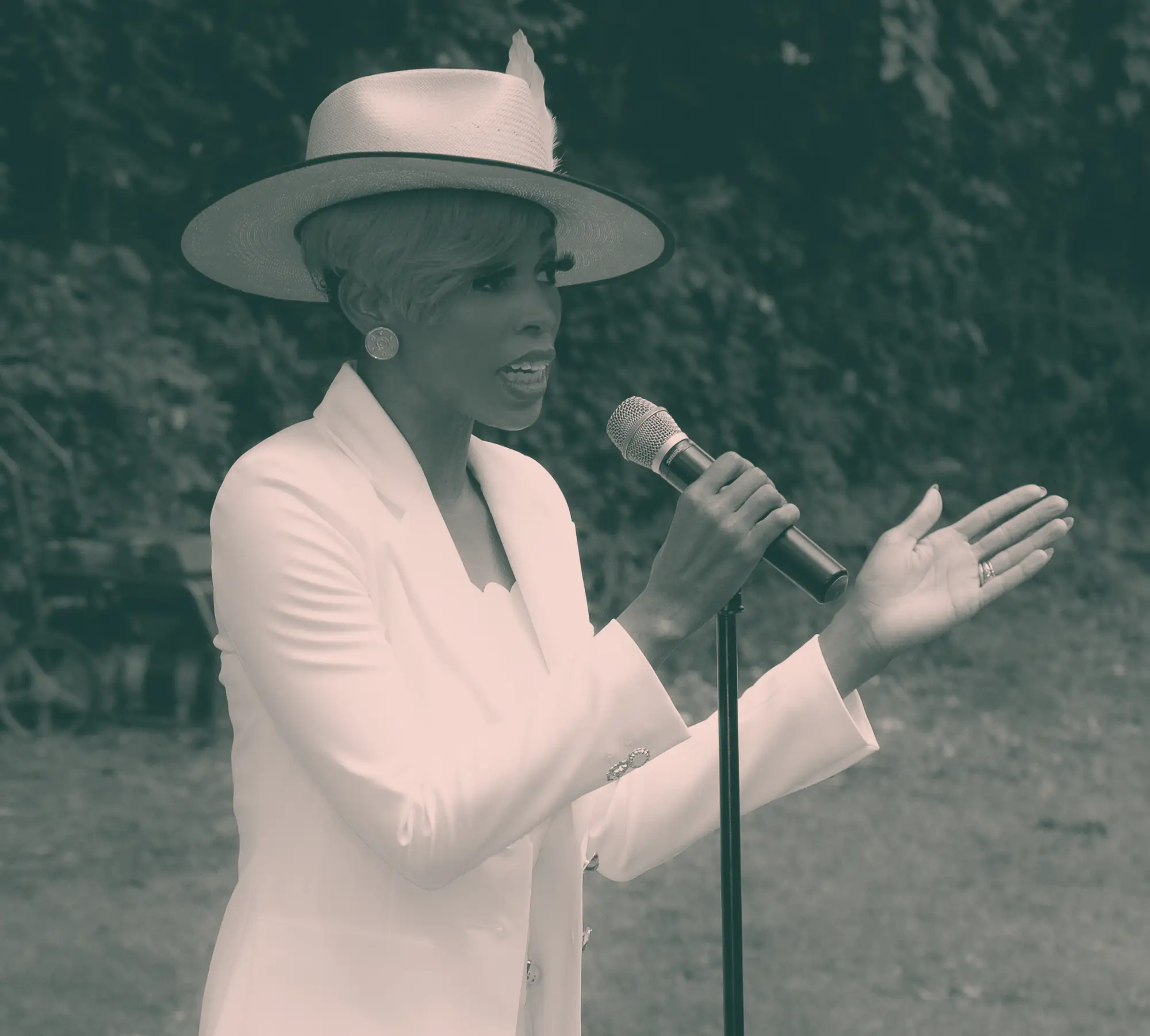 The founder addressing members outdoors